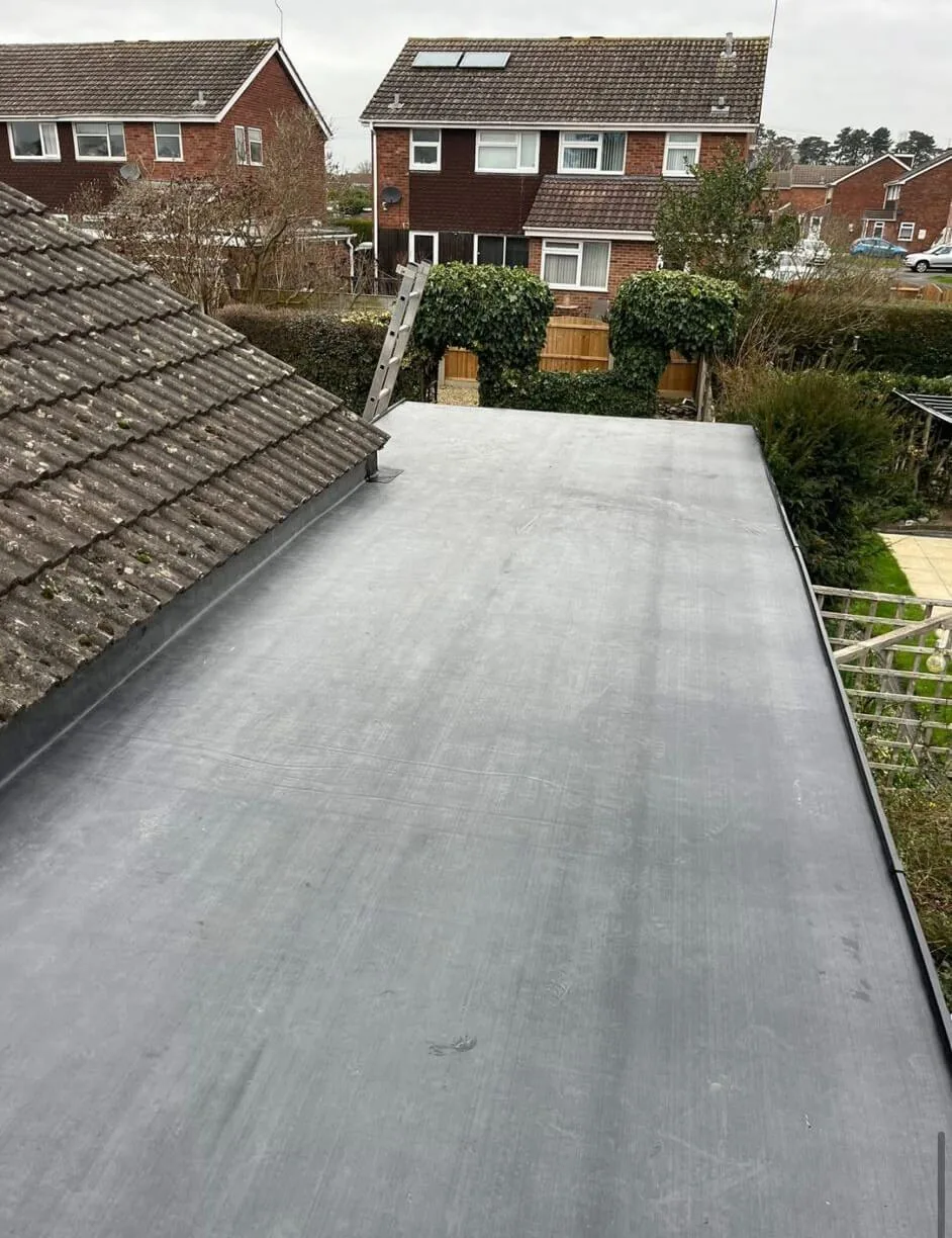 Freshly installed EPDM rubber flat roof on a house extension
