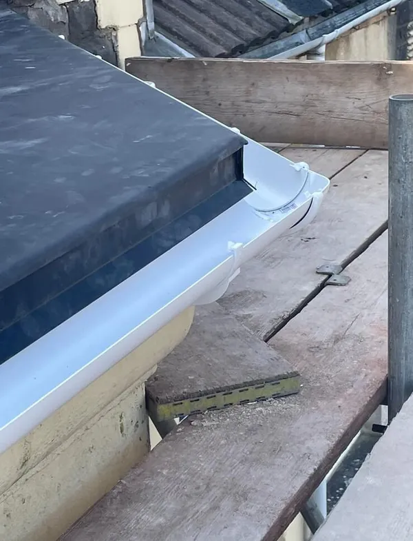 Close-up of new uPVC guttering fitted to a fascia board