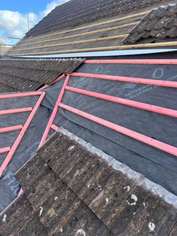 Roof mid re-roof showing breathable membrane, battens and tiles